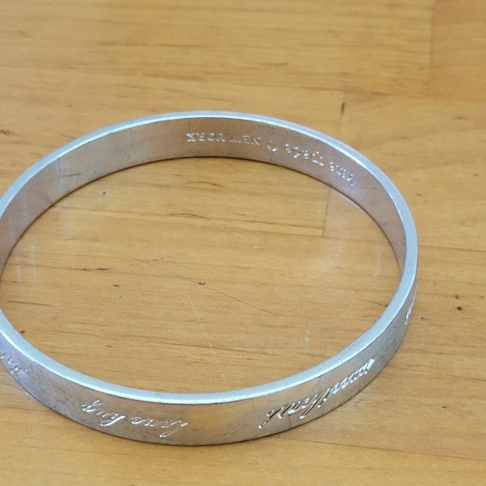 KATE SPADE Be Mine Idiom Silver Tone Engraved Bangle Bracelet